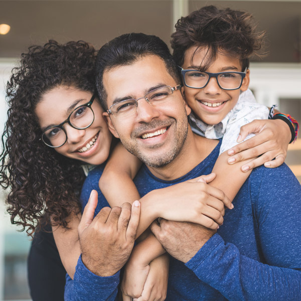 family of three smiling together