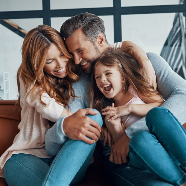 family of three laughing together