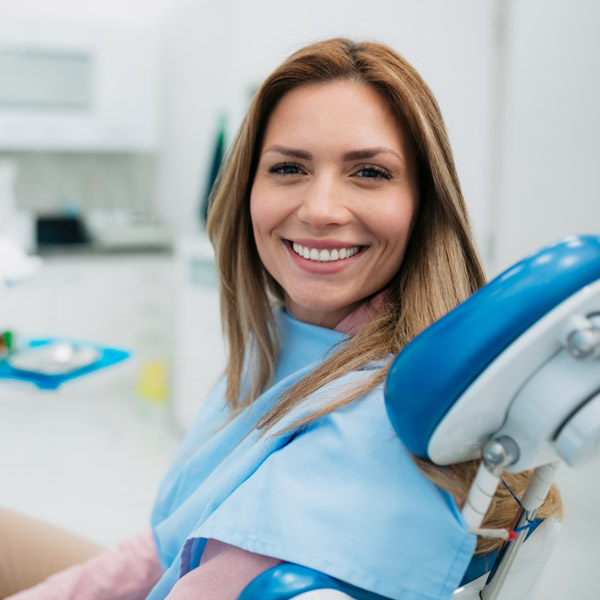 beautiful woman smiling in dental chair