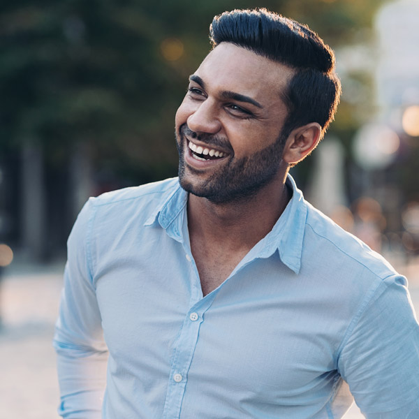 man in blue shirt smiling