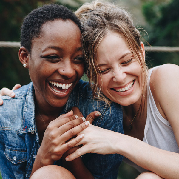 two friends laughing together